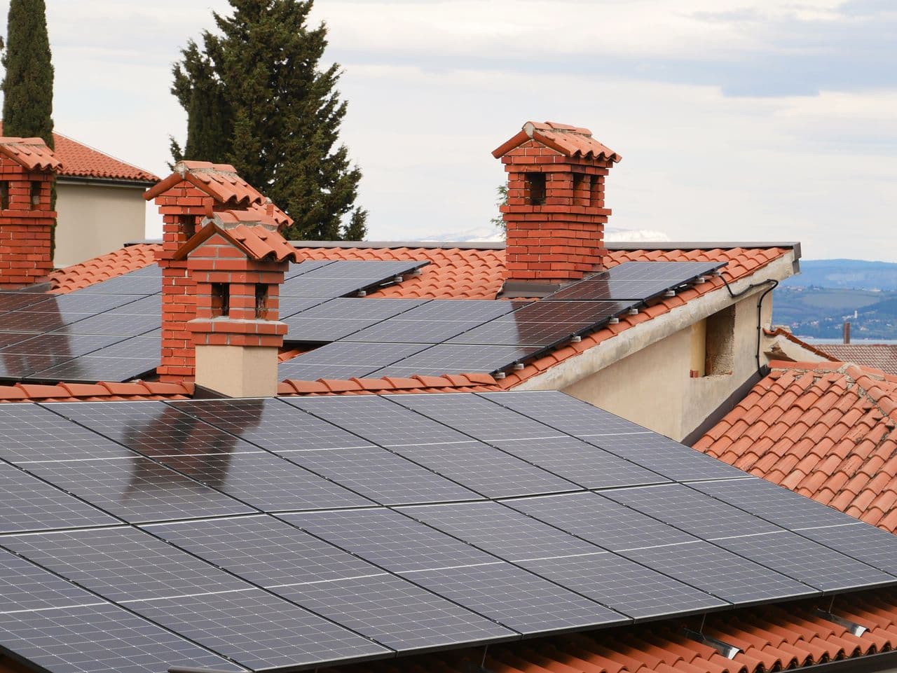 Solar panels across the tiled roof of a home